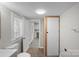 A well-lit bathroom, seen from the doorway, featuring modern fixtures at 310 Pineview St, Kannapolis, NC 28083