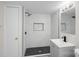 Modern bathroom with tiled shower, updated fixtures, and sleek design at 310 Pineview St, Kannapolis, NC 28083