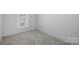 Cozy empty bedroom with carpet, a bright window, and minimalist design at 310 Pineview St, Kannapolis, NC 28083