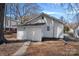 Exterior of house with siding and pathway, surrounded by bare trees and brown leaves at 310 Pineview St, Kannapolis, NC 28083