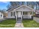 Charming single-story home featuring a cozy front porch and freshly painted exterior at 310 Pineview St, Kannapolis, NC 28083