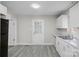 Bright kitchen features white cabinets, marble countertops, and updated appliances at 310 Pineview St, Kannapolis, NC 28083