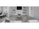 Bright living room featuring neutral walls, carpet, and built-in shelving at 310 Pineview St, Kannapolis, NC 28083