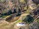 An aerial view of the property next to the golf course and pond creates a serene atmosphere at 32 Fairway Rdg, Lake Wylie, SC 29710