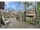 Relax on this spacious back deck with rustic railings and tranquil wooded views, perfect for outdoor entertaining at 32 Fairway Rdg, Lake Wylie, SC 29710