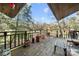 Entertain on this cozy back deck overlooking lush greenery and mature trees, perfect for enjoying the natural surroundings at 32 Fairway Rdg, Lake Wylie, SC 29710