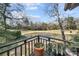 Enjoy this view of the backyard pond with a fountain feature from the home's private deck and take in the lush landscape at 32 Fairway Rdg, Lake Wylie, SC 29710