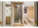 Bathroom with a glass shower stall, wood vanity, toilet and bathtub combination at 32 Fairway Rdg, Lake Wylie, SC 29710