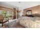 Spacious bedroom with brick accent wall and access to a private patio at 32 Fairway Rdg, Lake Wylie, SC 29710