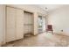 Bedroom with an empty closet, bare floors, and a door to the outside at 32 Fairway Rdg, Lake Wylie, SC 29710
