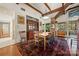 Charming dining room with hardwood floors, exposed beams, and stylish furnishings for elegant meals at 32 Fairway Rdg, Lake Wylie, SC 29710