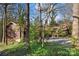 A beautiful single-story house is surrounded by mature trees and lush greenery at 32 Fairway Rdg, Lake Wylie, SC 29710