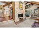 Cozy living area featuring a brick fireplace and exposed beams, perfect for Gathering gatherings at 32 Fairway Rdg, Lake Wylie, SC 29710