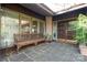Inviting front porch features stone flooring and a bench, offering a welcoming entrance at 32 Fairway Rdg, Lake Wylie, SC 29710