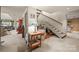 Inviting hallway featuring a staircase and decorative lamp on a wooden table at 32 Fairway Rdg, Lake Wylie, SC 29710