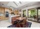 Bright kitchen with a skylight, butcher block island, stainless steel appliances, and adjacent access to the outdoor deck at 32 Fairway Rdg, Lake Wylie, SC 29710