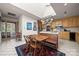 Bright kitchen with a skylight, butcher block island, stainless steel appliances, and an adjacent dining area with a wooden table at 32 Fairway Rdg, Lake Wylie, SC 29710