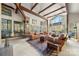 Spacious living room featuring vaulted ceilings, brick fireplace and large windows with nature view at 32 Fairway Rdg, Lake Wylie, SC 29710