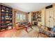 Inviting living room with a window view, bookshelves, a sofa, and a cozy rug at 32 Fairway Rdg, Lake Wylie, SC 29710