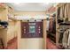 Spacious walk-in closet with ample storage and a unique golf-themed wall hanging at 32 Fairway Rdg, Lake Wylie, SC 29710