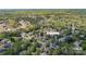 Aerial view of the property showcasing lush landscaping and the surrounding tree-lined neighborhood at 3304 Taviston Dr, Waxhaw, NC 28173