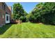Large, well-maintained backyard with lush lawn and mature trees offering ample privacy at 3304 Taviston Dr, Waxhaw, NC 28173