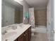 Bathroom featuring double vanity, a bathtub with shower, and tile floors at 3304 Taviston Dr, Waxhaw, NC 28173