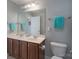 Bathroom with double vanity, dark wood cabinets, and tile floors at 3304 Taviston Dr, Waxhaw, NC 28173