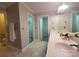 Bright bathroom featuring a double vanity, white countertops, and tile floors at 3304 Taviston Dr, Waxhaw, NC 28173