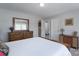 Bedroom with carpet, neutral walls, and dark wood furniture at 3304 Taviston Dr, Waxhaw, NC 28173