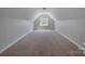 Open bonus room with carpet and natural light streaming through the window at 3304 Taviston Dr, Waxhaw, NC 28173