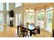A bright breakfast nook off the kitchen features a large bay window and a view of the exterior deck at 3304 Taviston Dr, Waxhaw, NC 28173