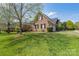 Brick home with large front yard and well manicured landscaping at 3304 Taviston Dr, Waxhaw, NC 28173