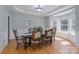 Elegant dining room featuring a decorative tray ceiling and large windows for ample natural light at 3304 Taviston Dr, Waxhaw, NC 28173