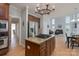 Gourmet kitchen with stainless steel appliances, granite countertops, and an island cooktop at 3304 Taviston Dr, Waxhaw, NC 28173