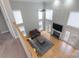 Aerial view of bright living room highlighting the fireplace, hardwood floors, and natural light at 3304 Taviston Dr, Waxhaw, NC 28173