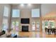 Bright living room features high ceilings, fireplace, and access to the outdoor deck at 3304 Taviston Dr, Waxhaw, NC 28173