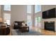 Open living area boasts high ceilings, a fireplace, and access to the deck at 3304 Taviston Dr, Waxhaw, NC 28173