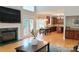 Spacious living room features a fireplace, hardwood floors, and kitchen view at 3304 Taviston Dr, Waxhaw, NC 28173