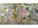 Aerial view of a lot with mature trees outlining property lines in a residential area at 335 Deep Forest Ct, Gastonia, NC 28056