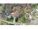 Aerial view of a neighborhood with mature trees and well-maintained homes at 335 Deep Forest Ct, Gastonia, NC 28056