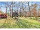 Spacious backyard with mature trees, partially fenced in yard at 335 Deep Forest Ct, Gastonia, NC 28056