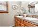 Bright bathroom with double sink vanity, decorative mirrors, and stylish decor at 335 Deep Forest Ct, Gastonia, NC 28056
