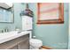 Charming bathroom with modern vanity, sink, and coordinating mirror at 335 Deep Forest Ct, Gastonia, NC 28056