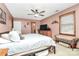 Comfortable bedroom with ceiling fan, windows, and light pink painted walls at 335 Deep Forest Ct, Gastonia, NC 28056