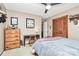 Bedroom featuring matching wooden desk and dresser with ceiling fan at 335 Deep Forest Ct, Gastonia, NC 28056