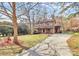 Spacious home with a long driveway, large yard and a welcoming covered front porch at 335 Deep Forest Ct, Gastonia, NC 28056