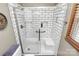 Updated bathroom with modern tiled shower featuring glass doors and fixtures at 335 Deep Forest Ct, Gastonia, NC 28056