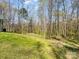 This home features a vast backyard with a natural forest, offering plenty of privacy at 350 Belvedere Nw Dr, Concord, NC 28027