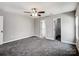 Bright bedroom with two closets, ceiling fan, and carpet flooring at 350 Belvedere Nw Dr, Concord, NC 28027